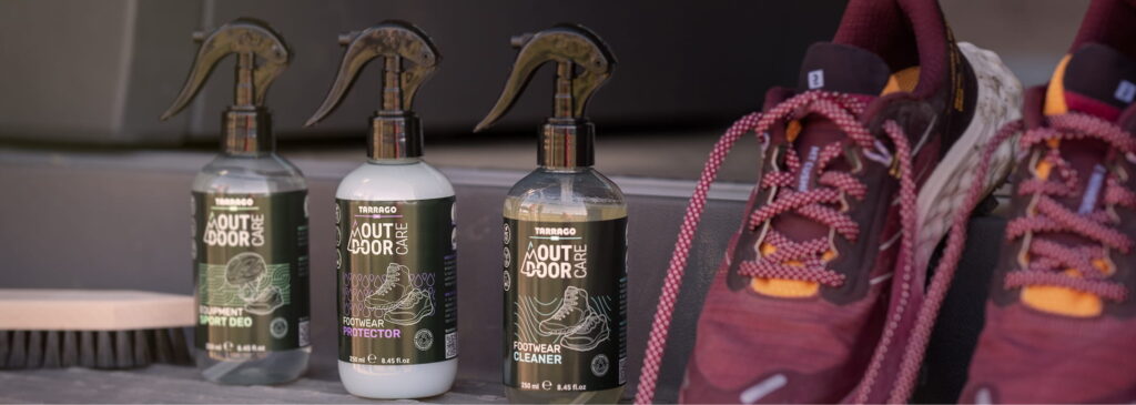 Footwear Care Tarrago Outdoor products with burgundy trail sneakers outside a van